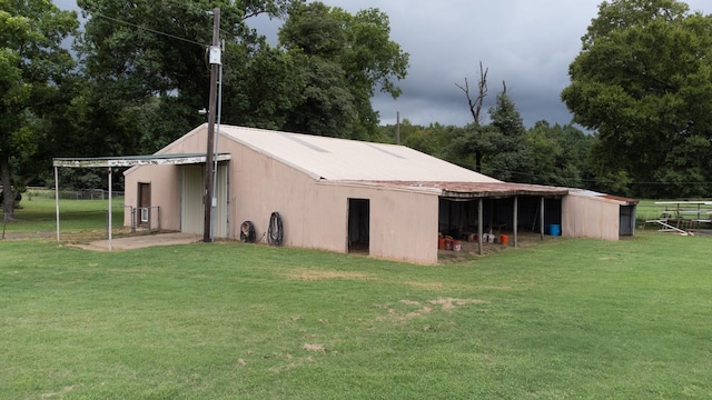 view of pole building with a yard