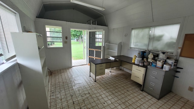 interior space featuring lofted ceiling and light tile patterned floors