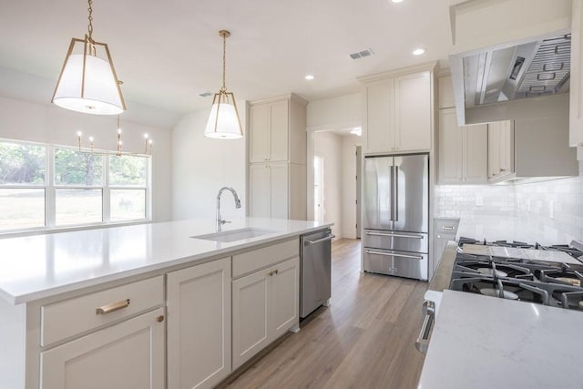 115 Palisades Dr, Gordonville, TX 76245 - kitchen with stainless steel appliances, tasteful backsplash, hanging light fixtures, and sink