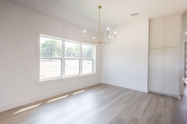 115 Palisades Dr, Gordonville, TX 76245 - unfurnished dining area with a notable chandelier and light hardwood / wood-style floors