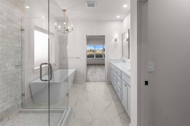 115 Palisades Dr, Gordonville, TX 76245 - bathroom featuring a chandelier, vanity, and separate shower and tub