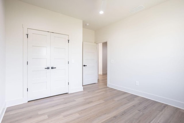 115 Palisades Dr, Gordonville, TX 76245 - unfurnished bedroom featuring light hardwood / wood-style floors and a closet