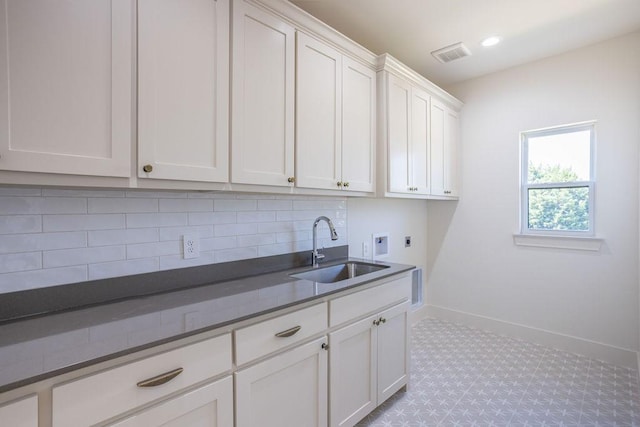 115 Palisades Dr, Gordonville, TX 76245 - clothes washing area featuring cabinets, electric dryer hookup, sink, and washer hookup