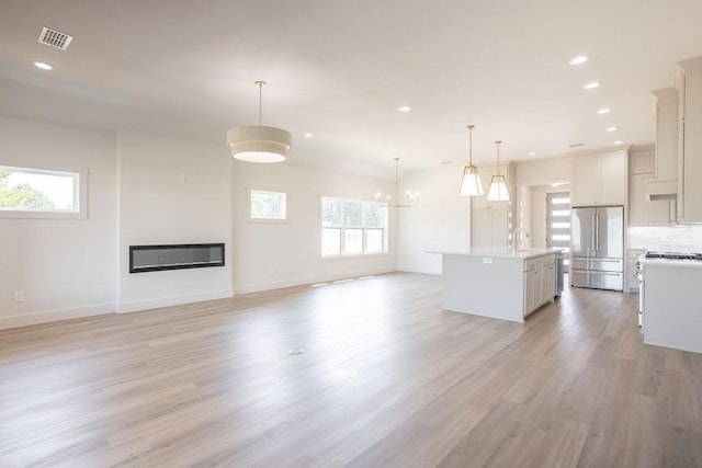115 Palisades Dr, Gordonville, TX 76245 - unfurnished living room featuring sink and light wood-type flooring