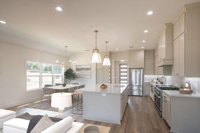 115 Palisades Dr, Gordonville, TX 76245 - kitchen featuring sink, high end appliances, a center island with sink, pendant lighting, and decorative backsplash