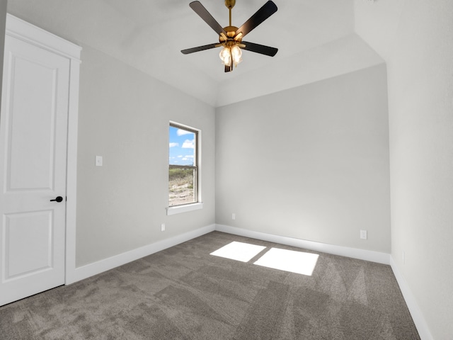 carpeted empty room with ceiling fan and baseboards