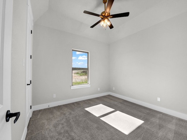 carpeted empty room with a ceiling fan and baseboards