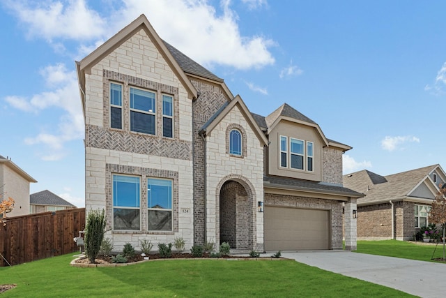 view of front of house featuring a garage and a front yard