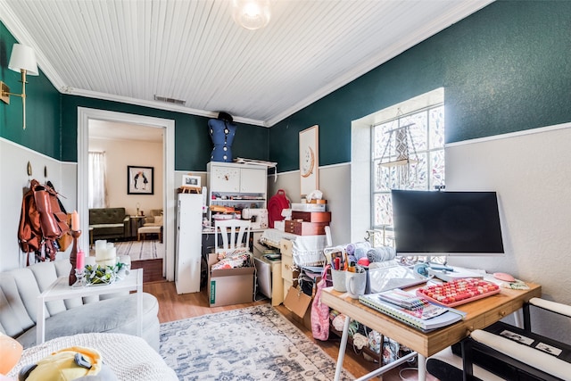 living room with light hardwood / wood-style floors and ornamental molding