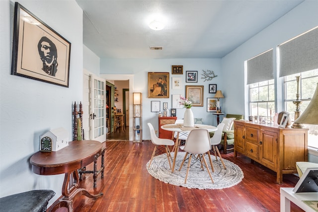 dining room with dark hardwood / wood-style flooring