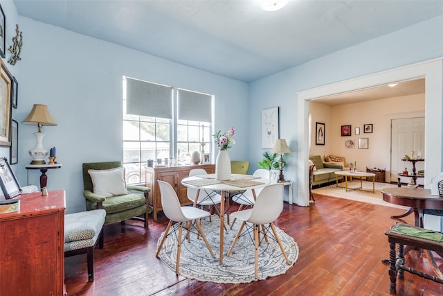 dining room with dark hardwood / wood-style floors