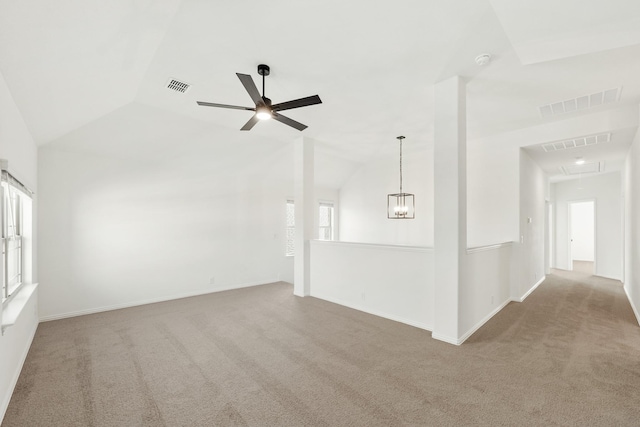 unfurnished living room with ceiling fan, lofted ceiling, and light carpet