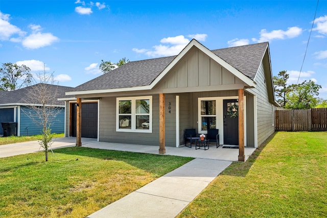 view of front of house featuring a garage and a front yard