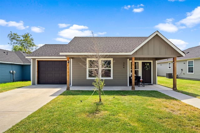 single story home featuring a front yard, covered porch, a garage, and cooling unit