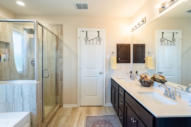 bathroom with plus walk in shower and vanity