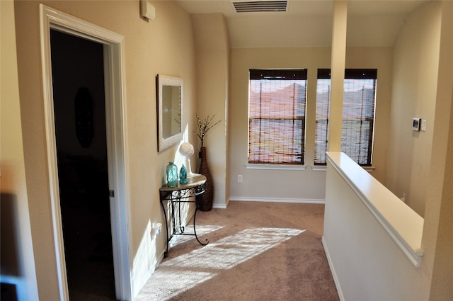 hallway with light carpet