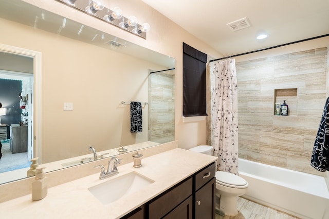 full bathroom with vanity, toilet, and shower / tub combo with curtain