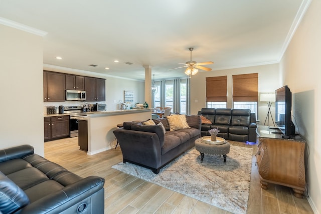 living room featuring light hardwood / wood-style flooring, ceiling fan, and crown molding