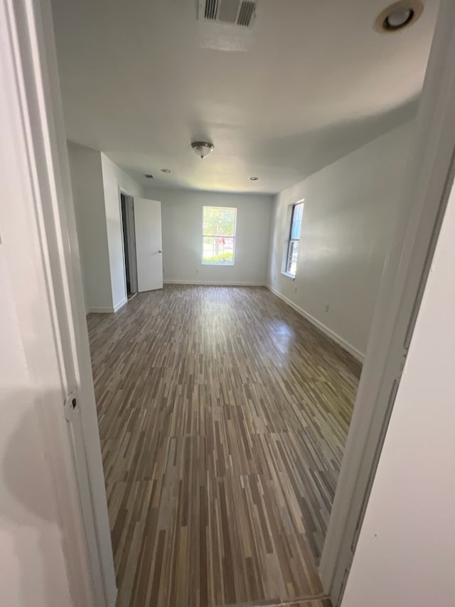 spare room featuring hardwood / wood-style floors