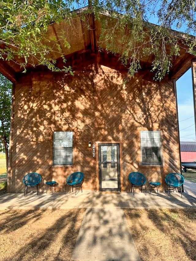 rear view of property featuring a patio area