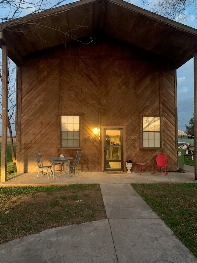 rear view of property featuring a patio area