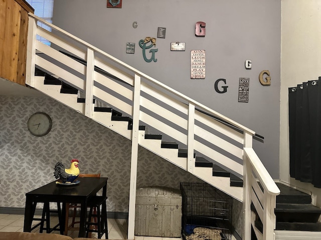 staircase featuring tile patterned flooring