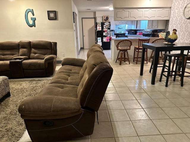 living room with light tile patterned floors