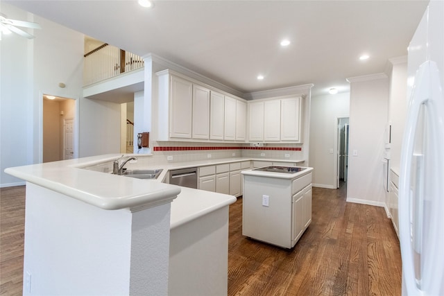 kitchen featuring kitchen peninsula, sink, white refrigerator with ice dispenser, wood-type flooring, and dishwasher