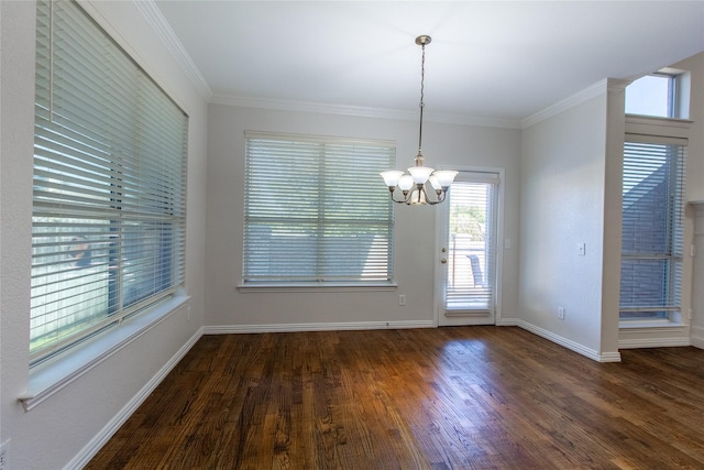 unfurnished dining area featuring crown molding, dark hardwood / wood-style flooring, and a notable chandelier