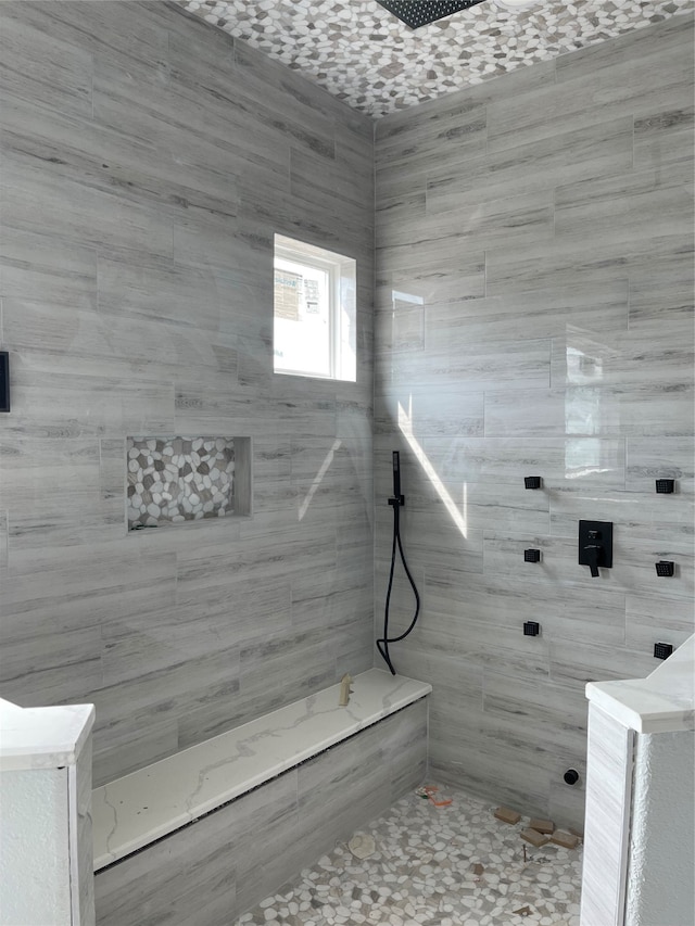 bathroom featuring tiled shower