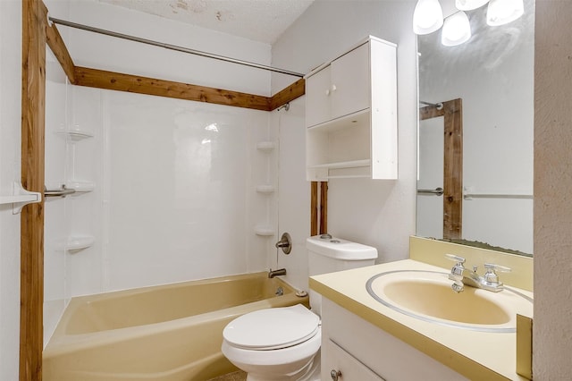 full bathroom featuring vanity, a textured ceiling, toilet, and washtub / shower combination