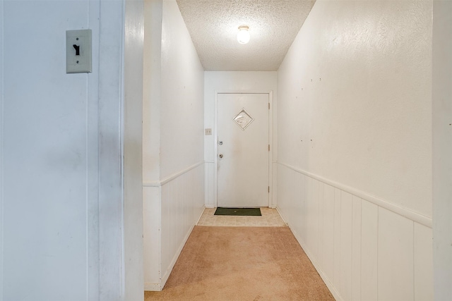 entryway with a textured ceiling