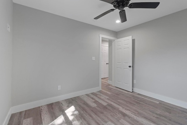 unfurnished room featuring ceiling fan and wood-type flooring