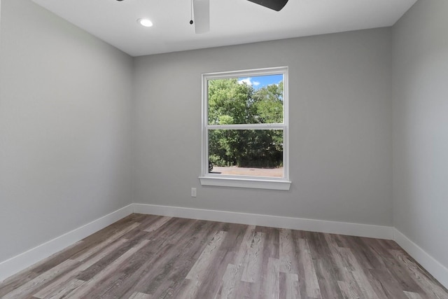 unfurnished room featuring ceiling fan and wood-type flooring