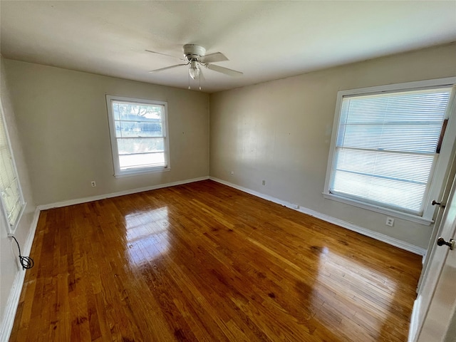 unfurnished room with ceiling fan and hardwood / wood-style flooring