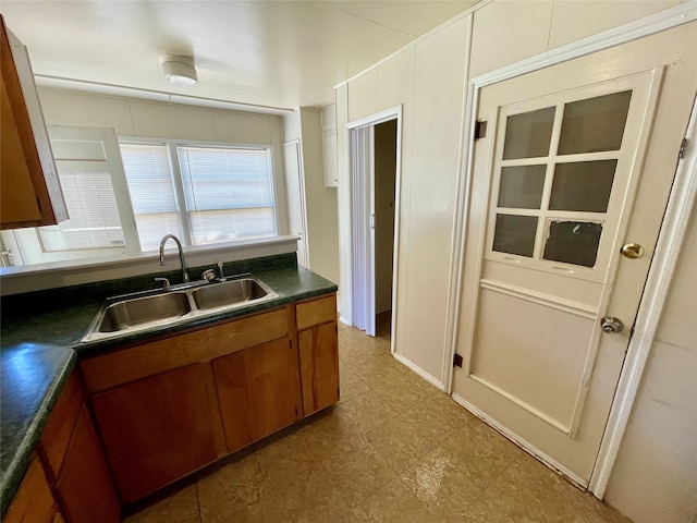 kitchen with sink and tile patterned floors