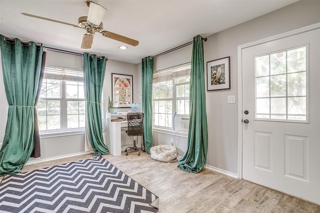 interior space featuring light hardwood / wood-style floors and ceiling fan