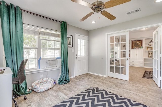 interior space featuring light hardwood / wood-style floors and ceiling fan