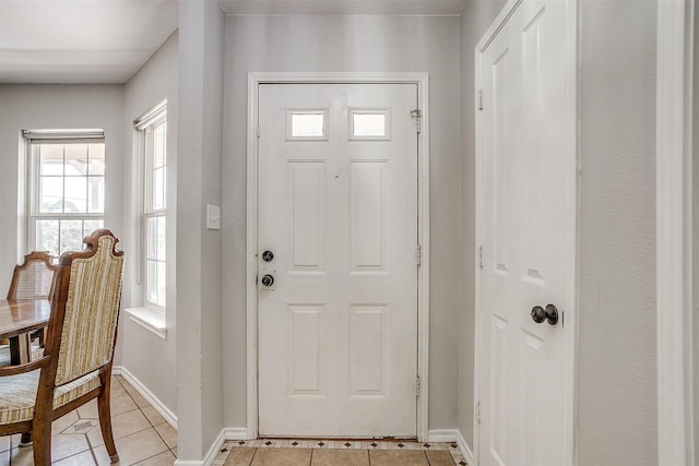 entrance foyer with light tile patterned floors