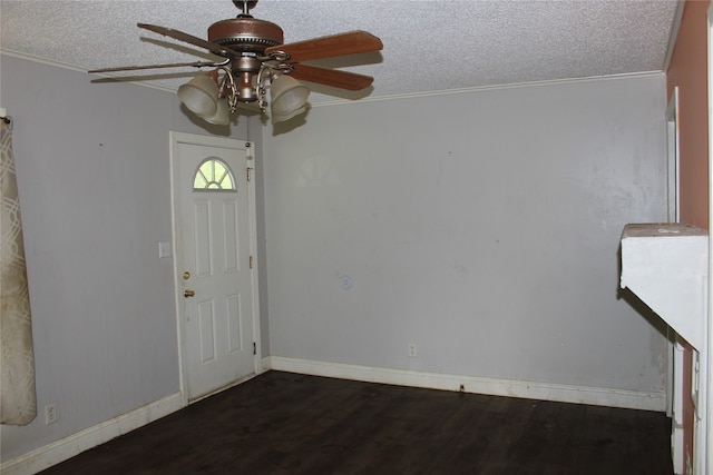 entrance foyer with a textured ceiling, ceiling fan, crown molding, and wood-type flooring