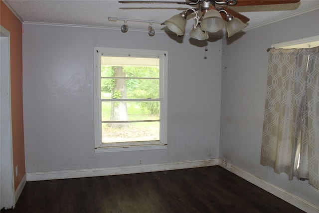 929 Forsythe St, Carthage, TX 75633 - unfurnished room with baseboards, wood finished floors, ceiling fan, and crown molding