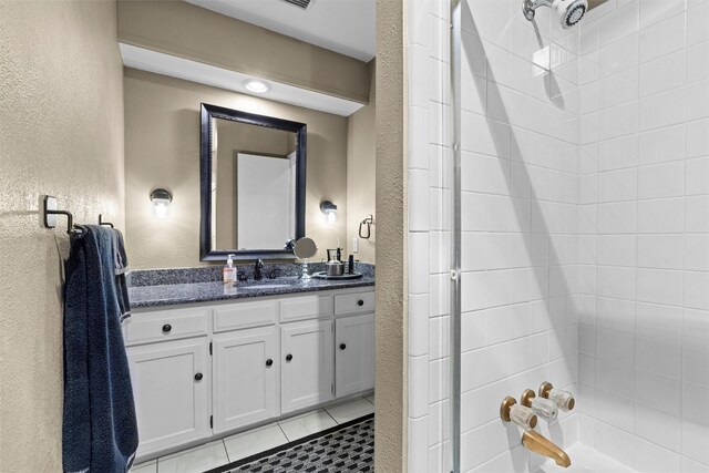 bathroom featuring tile patterned floors and vanity