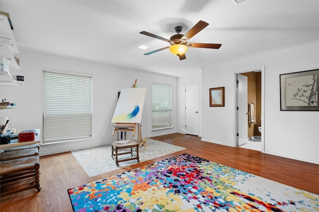 interior space with ceiling fan, light hardwood / wood-style flooring, and ornamental molding