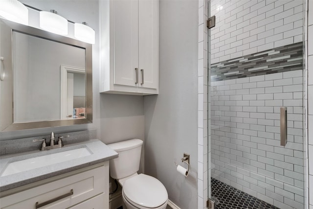 full bath with a shower stall, toilet, and vanity