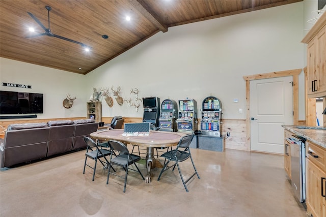 dining space featuring finished concrete floors, wood ceiling, beamed ceiling, and high vaulted ceiling