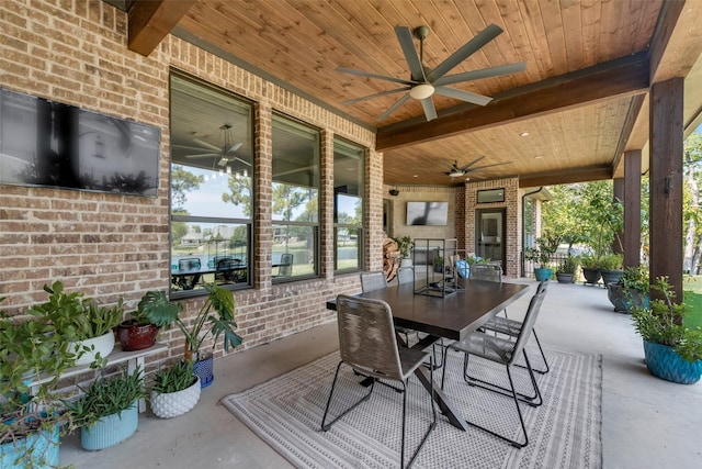 view of patio / terrace with ceiling fan and outdoor dining space