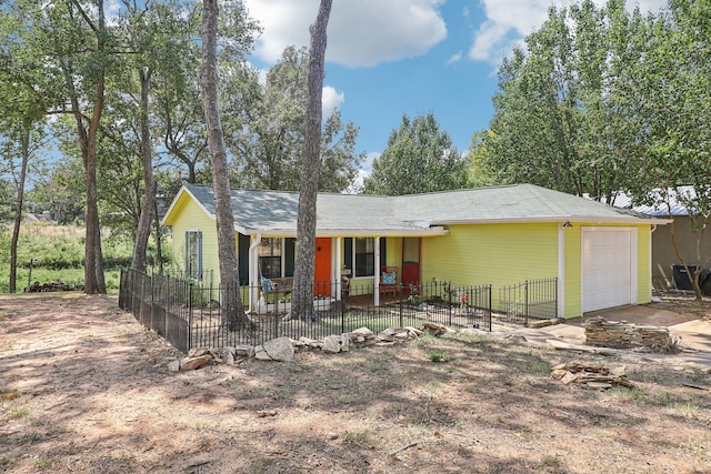 single story home with a garage and a porch