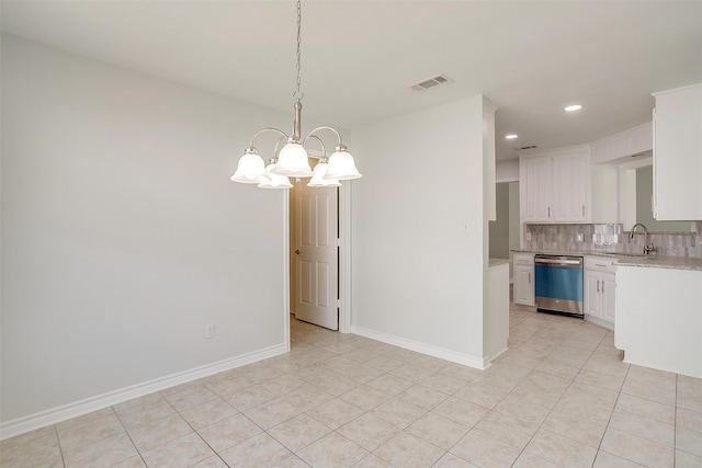 kitchen with tasteful backsplash, visible vents, white cabinets, decorative light fixtures, and stainless steel dishwasher