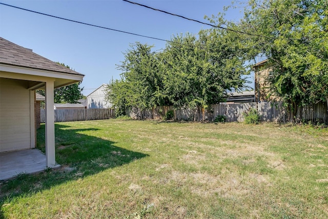 view of yard with a fenced backyard