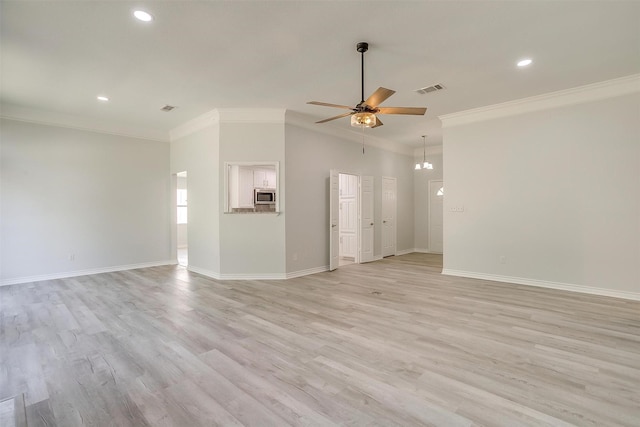 unfurnished living room with ornamental molding, light wood-type flooring, visible vents, and ceiling fan